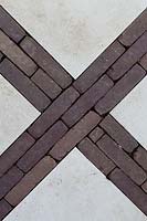 Detail of brick work design through paving stones.