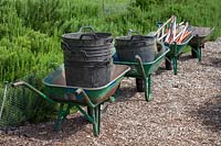Wheelbarrows full of equipment positioned ready to commence work 