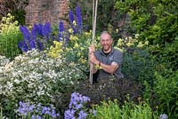 Gordon Baillie, head gardener at Arley Hall, standing in the herbaceous borders.