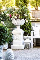 Large white urn container with roses, Terrace garden, Milan, Italy