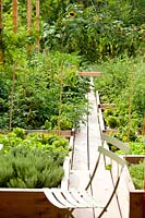 Closely-spaced vegetable raised beds with narrow path between