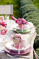 Wedding place settings decorated with roses
