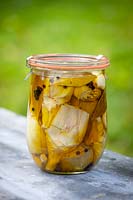 Pickled artichokes in kiln jar