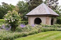 The Rose Walk and Thunder House from the Main Lawn. 