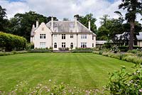 Norney Wood House across the main lawn.