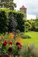 View across the flower bed and lawn towards the Wisteria pergola