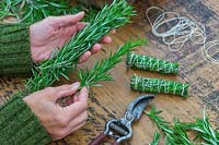 Smudge stick made with Salvia rosmarinus syn. Rosmarinus officinalis - Rosemary - clippings tightly packed, strung with cotton and trimmed