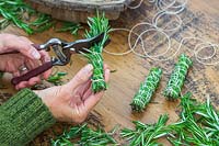 Smudge stick made with Salvia rosmarinus syn. Rosmarinus officinalis - Rosemary - clippings tightly packed, strung with cotton and trimmed