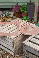 Wooden disk with drilled countersunk holes for fixing the disk to the wooden post. 