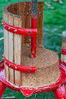 An apple press showing the pressed mash after the juice has been extracted. 