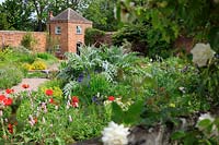 Planting in front of the brick folly built in to the walls of the walled garden.