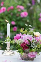 Summer floral arrangement in silverware