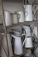 Collection of enamel jugs in the flower arranging studio