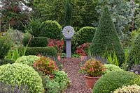 Modern sculpture by Wendy Lawrence in formal country garden