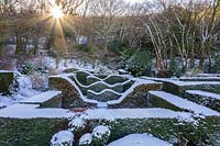 View over the snow-covered Hedge Gardens and coppice.  Garden â€“ Veddw