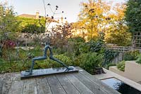 Low maintenance  city garden - view from elevated deck with reflecting pool and Mike Speller's sculpture