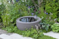 The Communication Garden. A water bowl from Urbis Design planted amongst hardy geraniums, astrantias, hostas, alchemilla, tiarellas and mind-your-own business.