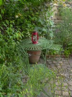 Quiet seating area in secluded garden  June Norfolk