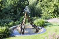 Fountain on wooden structure above pool made by Jane Hazelwood. July