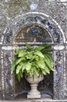 Highly decorated wall at back of a raised pool in the Garden of Venus. Wall is faced with mosaics and contains niche with urn containing ferns. Lisbon, Portugal, September.