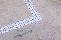 Stone path and patio with Arabic design decorative tile designs