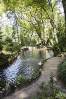 Pond in the park with curved grit path. Parque da Pena, Sintra, near Lisbon, Portugal, September.