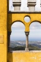 View over the park through arch of the palace. Parque da Pena, Sintra, near Lisbon, Portugal, September.