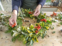 Add berries to completed Christmas wreath
