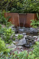 Rusted metal trough water feature at RHS Chelsea Flower Show 2021, Yeo Valley Garden