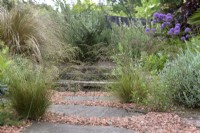 Gravel and stone pathway, interplanted with grasses