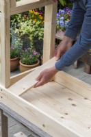 Step-by-Step Making a Potting Bench. Step 9: insert cross pieces on the underside of the work surface, to hold the planking together