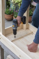 Step-by-Step Making a Potting Bench. Step 9: screw cross pieces onto the underside of the work surface, to hold the planking together