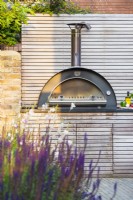 Bespoke kitchen unit with integrated pizza oven and storage. 