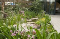 Fountain and stream in 'The Hide Garden' at the RHS Malvern Spring Festival 2022  - Designer - Emily Crowley-Wroe - Best in Show - Silver Gilt Medal