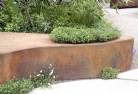 Sculpted metal seat with integrated planting