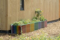 Modern colourful transparant plant containers.