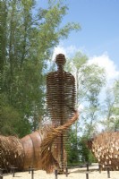 Corten steel human statue as landart designed by Will Beckers.