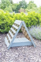 Painted pallets positioned in a triangle