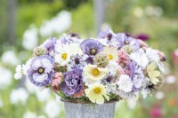 Bouquet containing Cosmos 'Lemonade', Papaver rhoeas 'Amazing Grey', Nigella papillosa 'Delft Blue', Centaurea 'Ball White', Limonium 'Apricot Beauty', Scabiosa stellata 'PingPong'