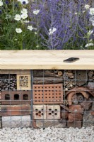 Insect hotel seating in the Turfed Out garden at RHS Hampton Court flower show 2022 - Designed by Hamzah-Adam Desai