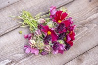 Bouquet containing Cosmos 'Rubenza', Centaurea 'Black Ball', Scabiosa stellata 'PingPong' and Nigella seed pods