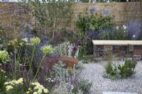 Pink and purple themed perennial planting in Turfed Out at RHS Hampton Court Palace Garden Festival 2022