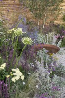 Pink and purple themed perennial planting in Turfed Out at RHS Hampton Court Palace Garden Festival 2022