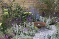 Pink and purple themed perennial planting in Turfed Out at RHS Hampton Court Palace Garden Festival 2022