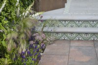 Decorative tiles as feature on the steps in the Marshalls Landscaping Garden at BBC Gardeners World Live 2022