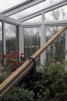Many conservatories have poor wind bracing to deal with storm force winds - here an owner has put in a temporary timber brace to avoid gale damage