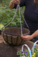Replacing a chain on a hanging basket