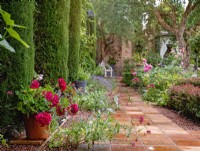 Gravel-edged paved tiled pathway surrounding the Carpet Garden, July, 2022.