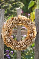Pistachio shell wreath on fence.