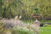 Decorative urn with winter planting of evergreens at John Massey's garden in October.